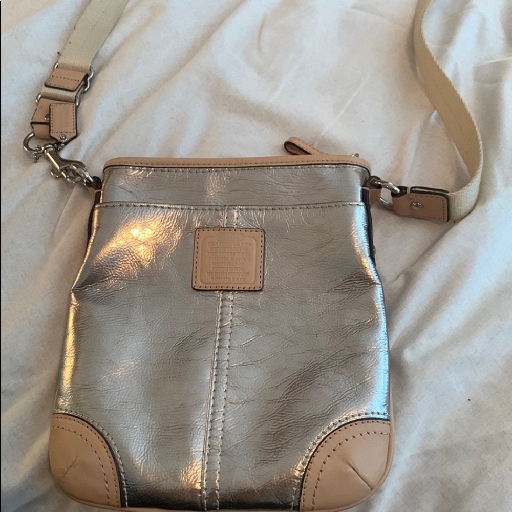 Silver Coach crossbody bag.